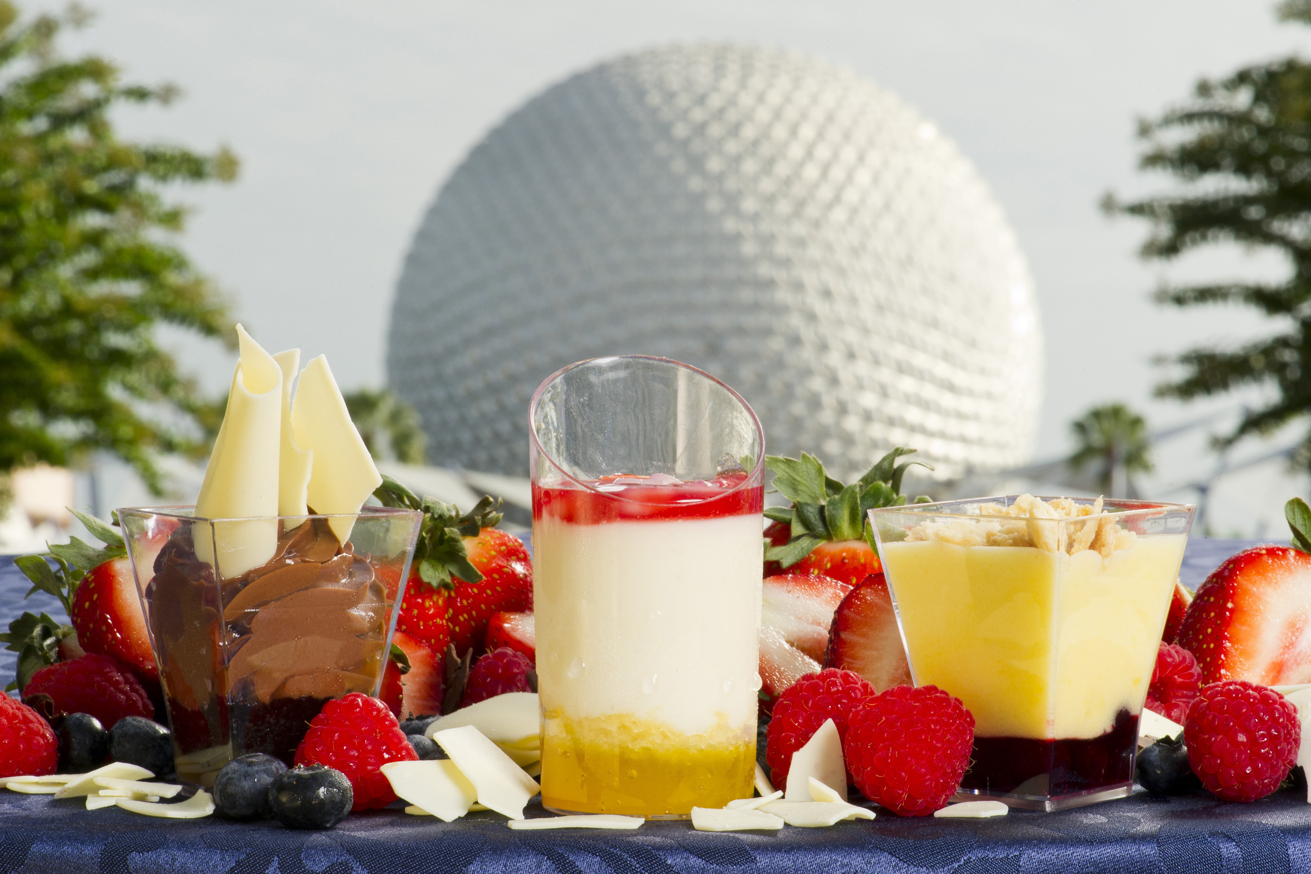 Three new standout sweet tastes are on the menu at the Desserts & Champagne marketplace during the 17th Epcot International Food & Wine Festival Sept. 28-Nov. 12, 2012 at Walt Disney World Resort in Lake Buena Vista, Fla.  From left to right:  Dark chocolate mousse with chili and salted caramel; yogurt panna cotta with orange cake, raspberries and pomegranate; and lemon custard verrine with blueberry compote. (Matt Stroshane, photographer)